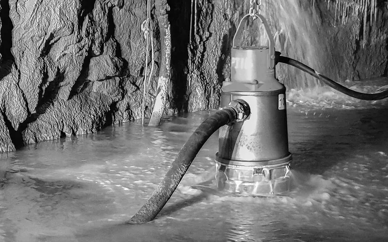 Submersible dewatering pump running in a flooded mine working