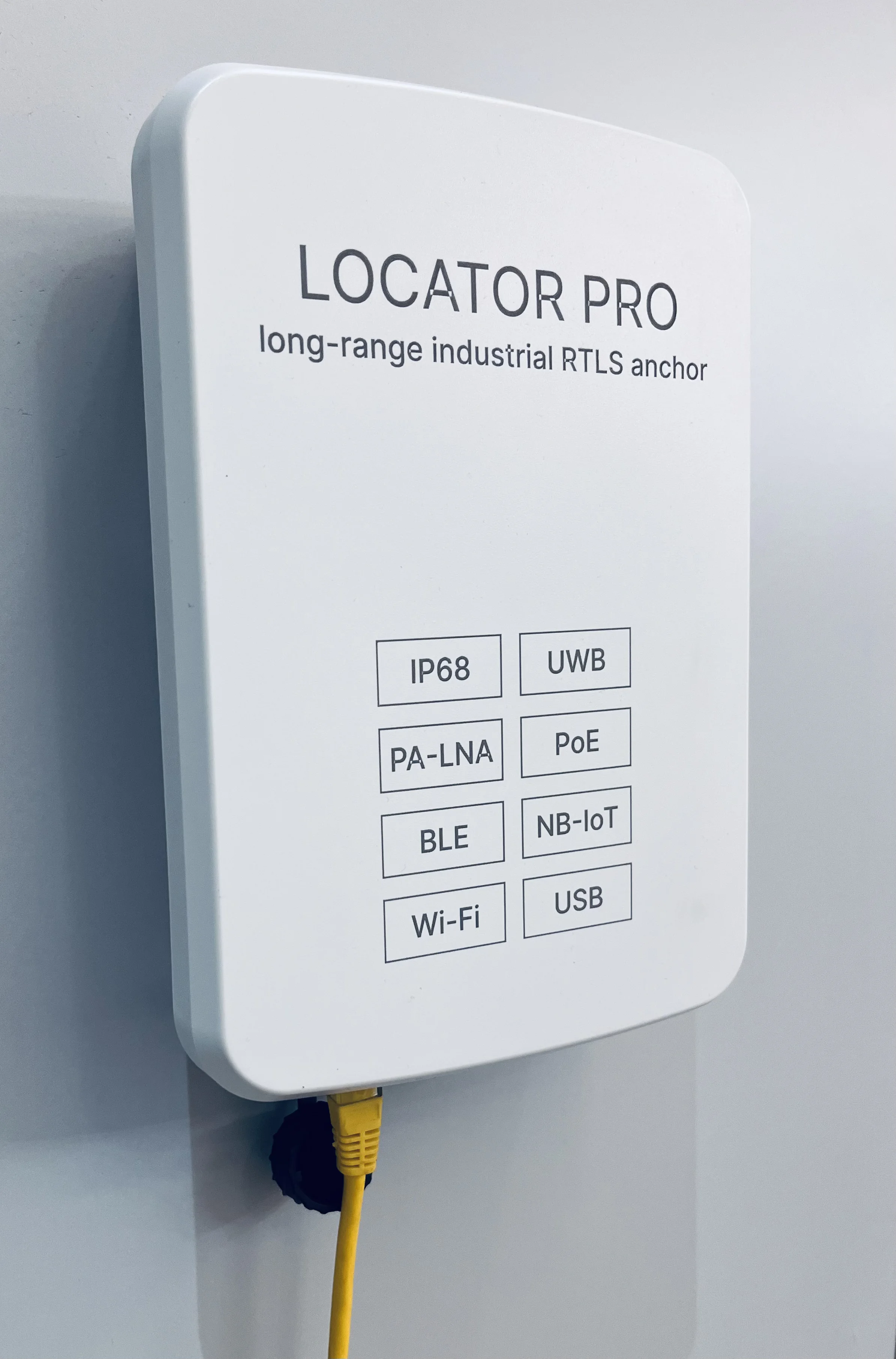 Locator Pro v3.0 wall-mounted with a PoE cable connected